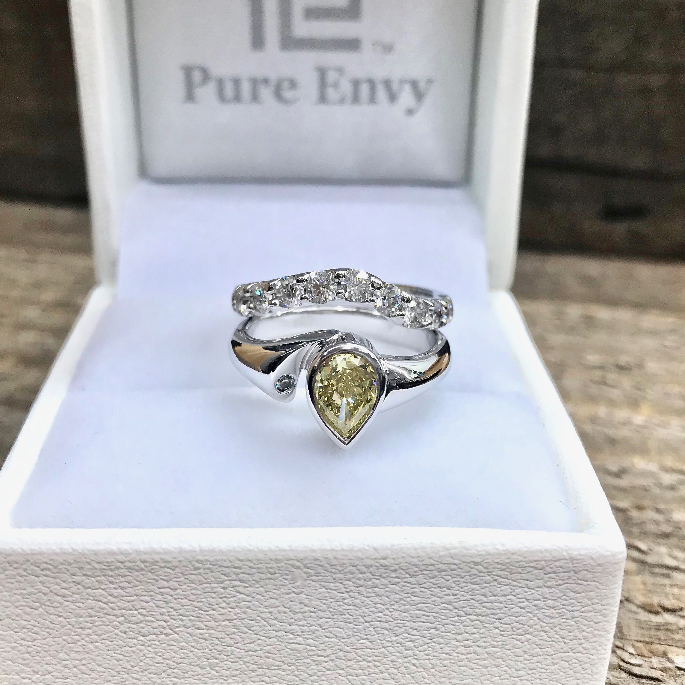Yellow diamond pearshapes engagement ring