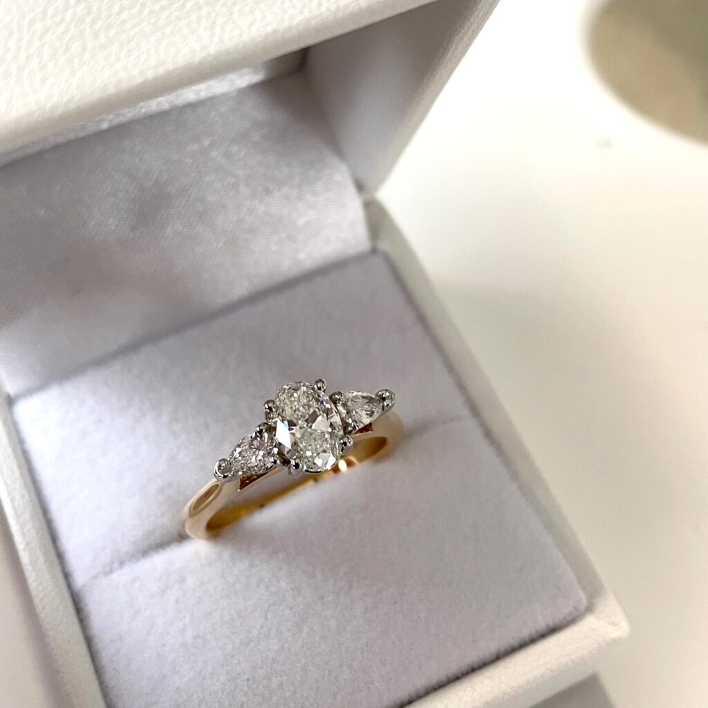 oval trilogy engagement ring by pure envy